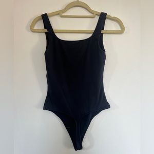 3 black Aritzia body suits